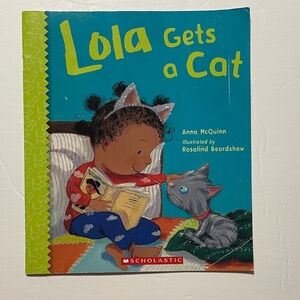 Scholastic Teal Cover with Yellow Title and Green Spine - "Lola Gets a Cat"